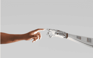 AI business process automation - human arm reaching toward a robot arm