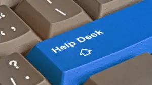 Grey keyboard with blue help desk key