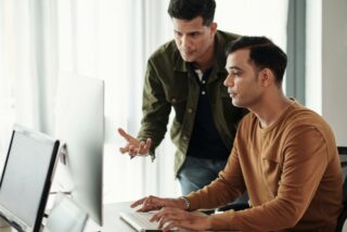 Two men at a computer